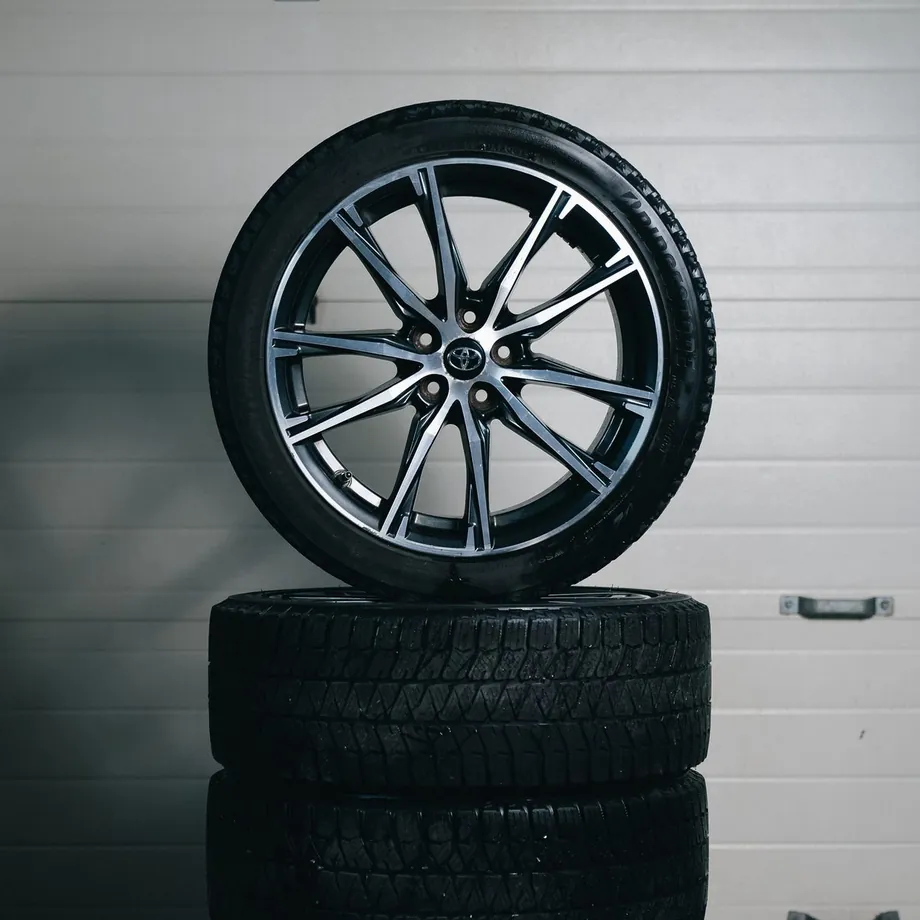 Alloy wheel on a stack of tyres